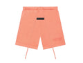 Peach-colored shorts on a white background