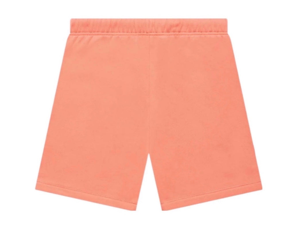 Peach-colored shorts on a white background