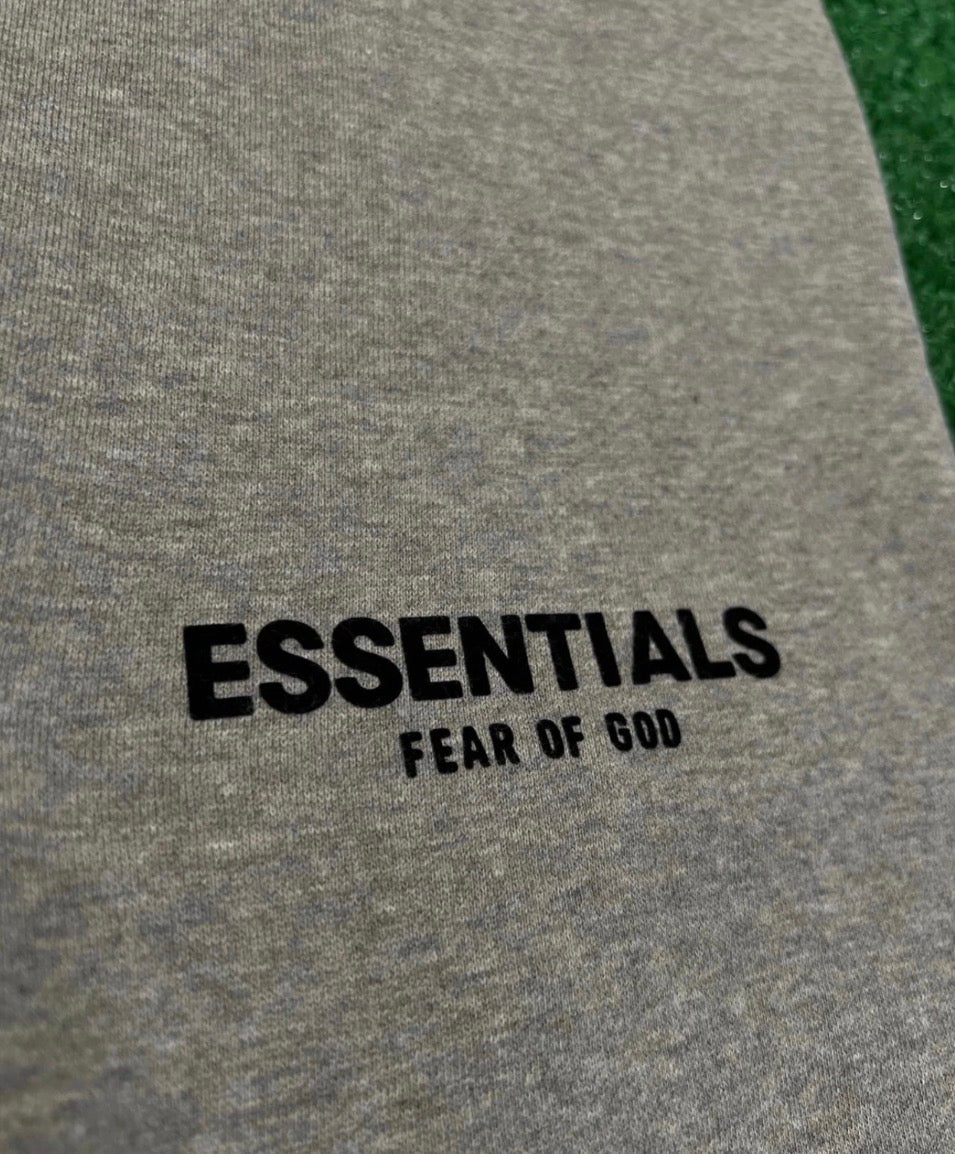grey close-up hoodie on grass in the back 