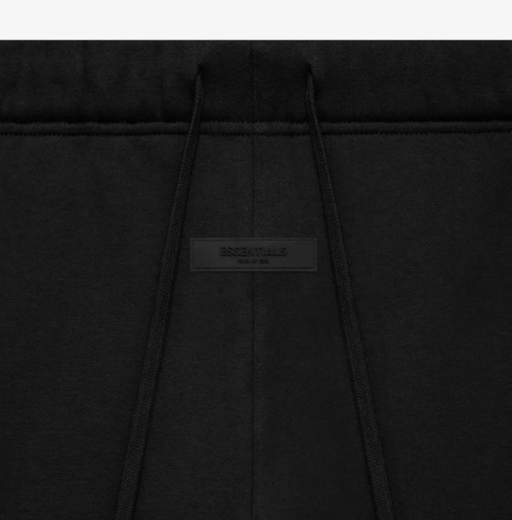 black sweatpants showing strings of the sweats